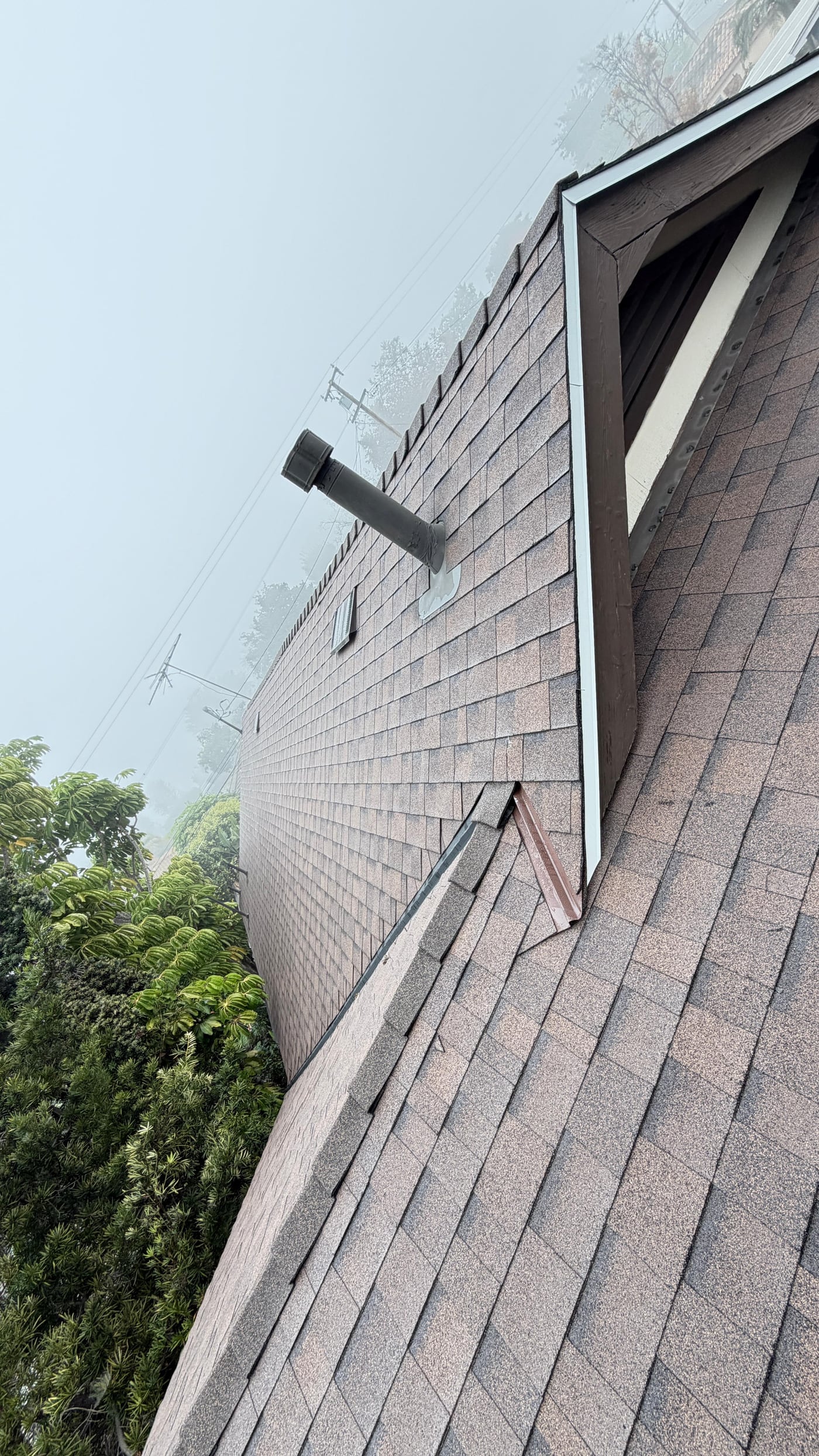 Roof leak repair area near a wall penetration